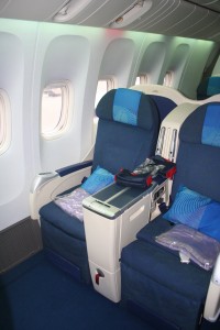 a plane with blue seats and a table