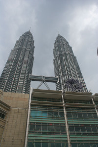 a two tall buildings with a sign on top