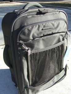 a black suitcase with a mesh pocket