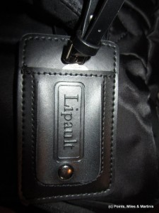 a black leather luggage tag