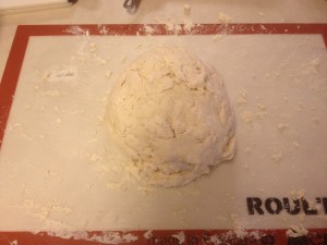 a ball of dough on a cutting board