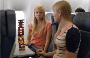 two women sitting in an airplane