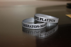 a pair of silver bracelets with black text