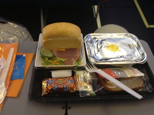 a sandwich and salad on a tray