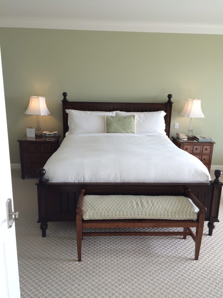 The king bed in the main bedroom