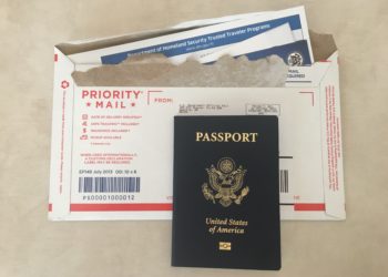 a passport and envelope with a receipt