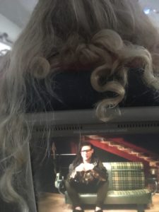 a person's hair on a television screen