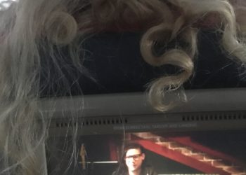 a person's hair on a television screen
