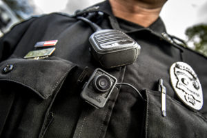 a police officer with a camera on his chest