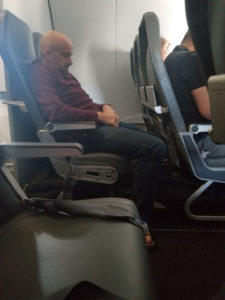 a man sleeping in a plane