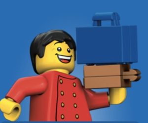 a lego man holding a briefcase