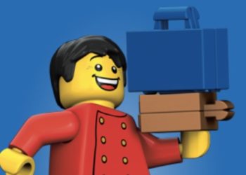 a lego man holding a briefcase