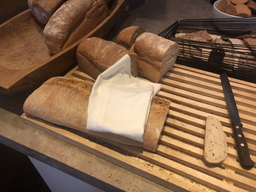 a loaf of bread on a wooden cutting board