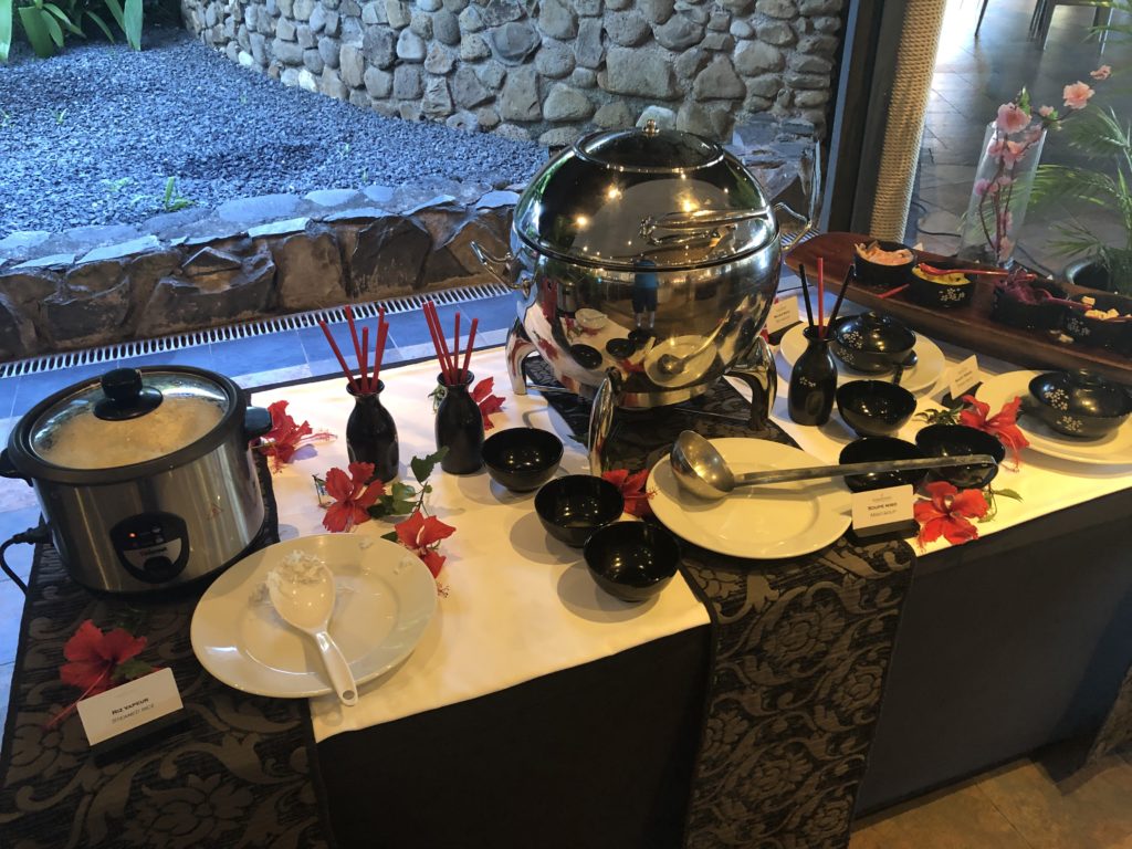 a table with a pot and utensils on it