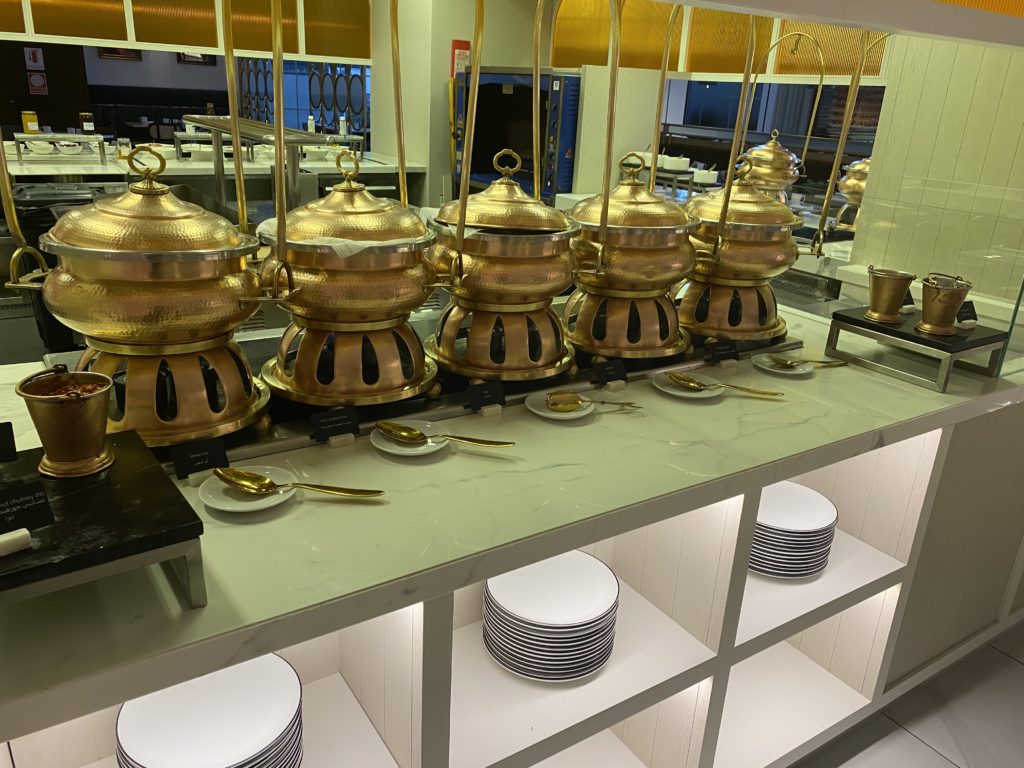 a group of gold pots on a counter