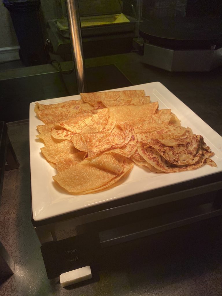 a plate of crepes on a counter