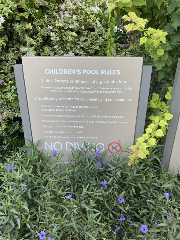 a sign in a garden
