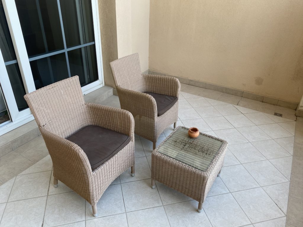 a wicker chairs on a patio