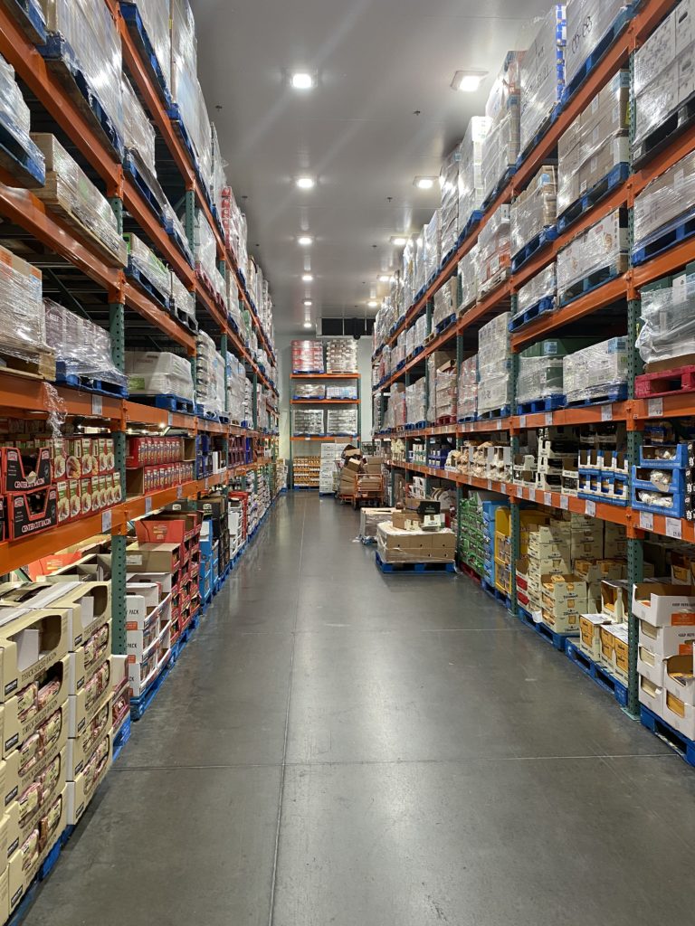 a warehouse with shelves of boxes and boxes