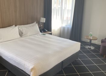 a bed in a hotel room