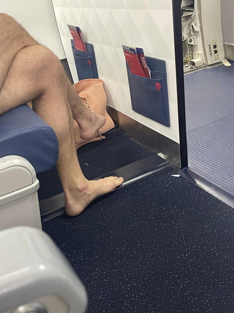 a person's legs on a seat