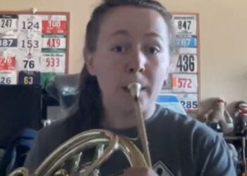 a girl playing a horn
