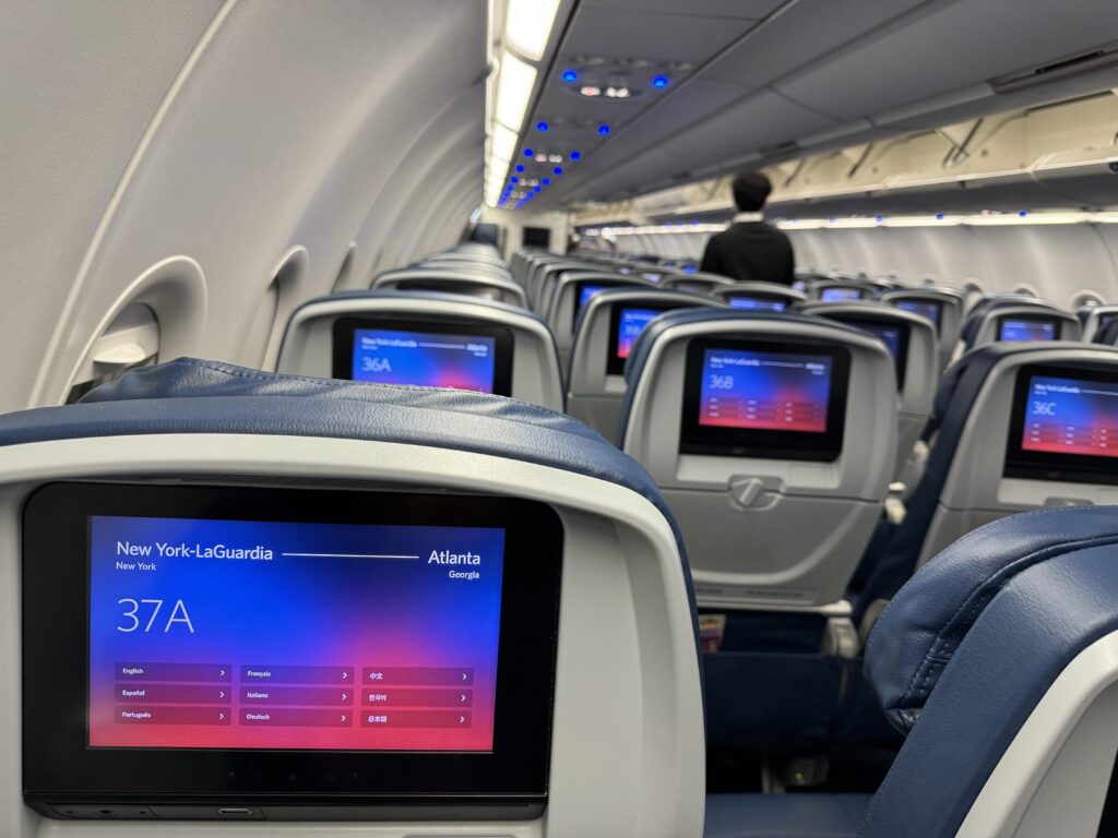 a seats on an airplane with a screen