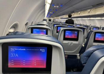 a seats on an airplane with a screen