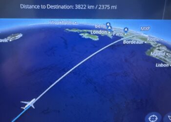 The image shows an in-flight entertainment screen displaying a flight map. The map indicates the plane's current position over the Atlantic Ocean, with a flight path leading towards Europe. Cities like Stockholm, Berlin, London, Paris, Bordeaux, Rome, and Lisbon are marked. The top of the screen shows the distance to the destination as 3822 kilometers or 2375 miles. An airplane icon is shown on the flight path.